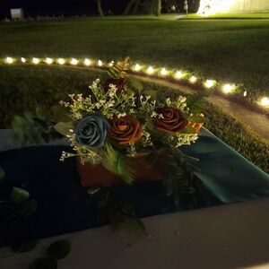 Elegant Floral Arrangement with Blue and Brown Roses